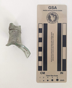 Broken section of a clear glass bottle