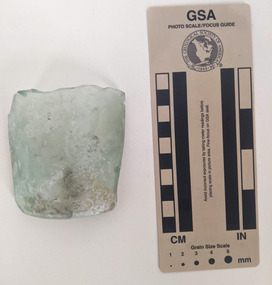 Broken section of a clear glass bottle