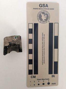 Non-translucent glass shard from a bottle