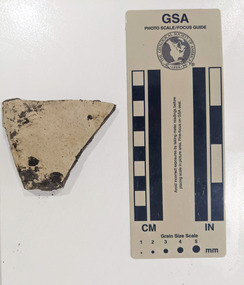 Ceramic shard with white glazed finish 