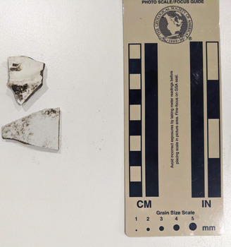Two pieces of ceramic shards with white glazed finish 