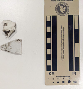 Two pieces of ceramic shards with white glazed finish 