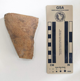 Ceramic shard with orange finish