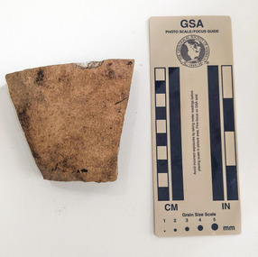 Ceramic shard with orange finish
