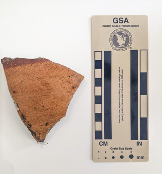 Ceramic shard with orange finish