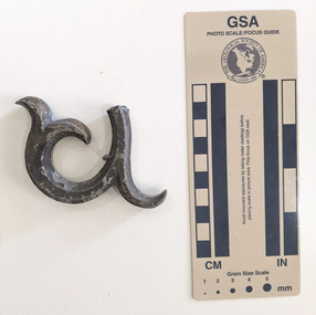 A decorative, spiral shaped piece of iron