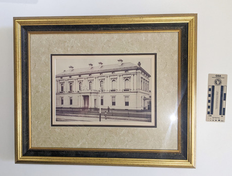 Black and White photograph of a grand two story Victorian Era building.