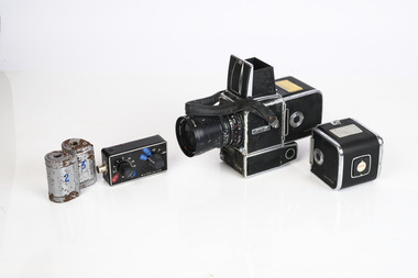 Hasselblad aerial camera with carry case, spare batteries, and film cases (overall poor condtion)