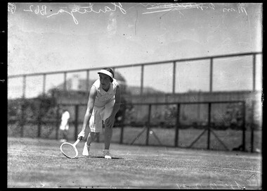 Photograph, Bull, Hugh Jones, 1897-1993, Tennis player Joan Hartigan (Australia) tries a low ball, 1934 Victorian Championships, Kooyong