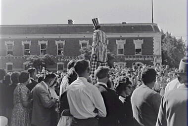 Negative - Bendigo Easter Fair 1963 - Stilt Walker - Bendigo Show Grounds Hotel, Allan Doney, 1950 -1970