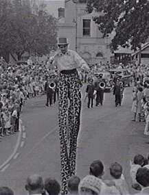 Negative - Bendigo Easter Fair 1964 - Stilt Walker, Allan Doney, 1950 -1970