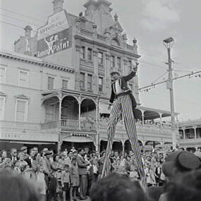 Negative - Bendigo Easter Fair 1958 - Stilt Walker, Allan Doney, 1950 -1970