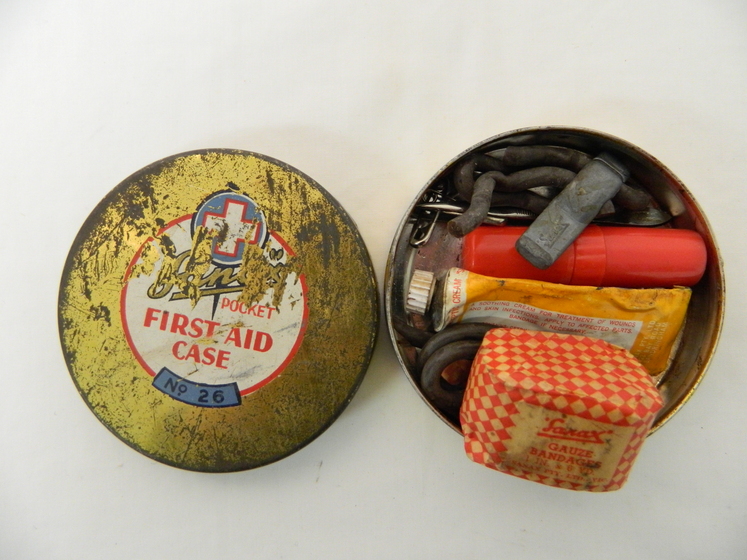 a tin with lid containing first aid supplies