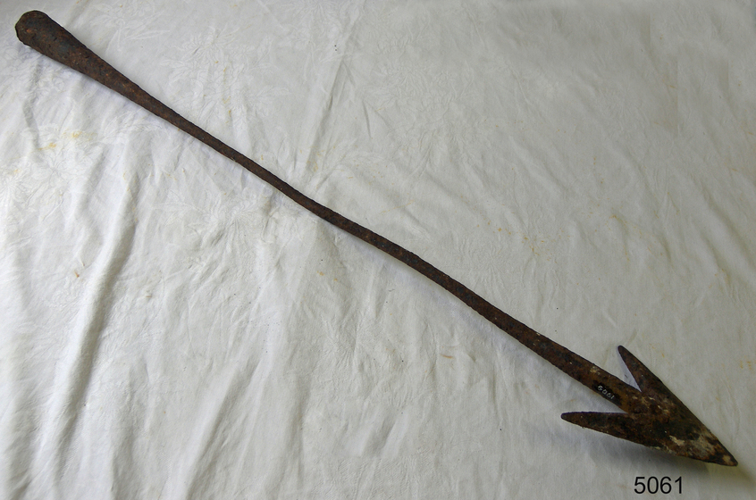 metal arrow on white sheet