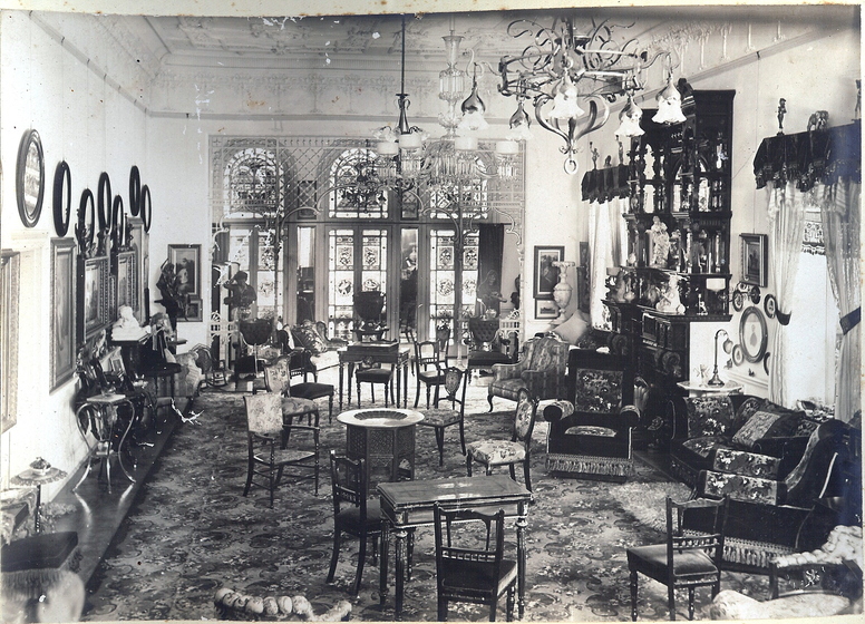 monochrome photograph of room with chairs and tables