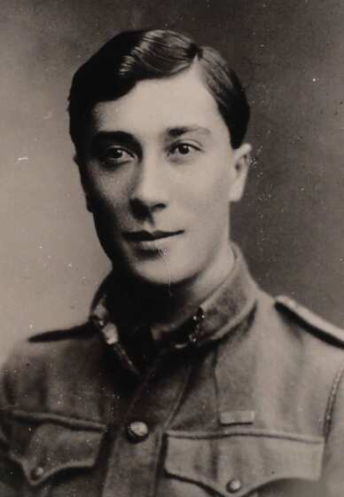 formal military portrait of a young man in uniform, black and white