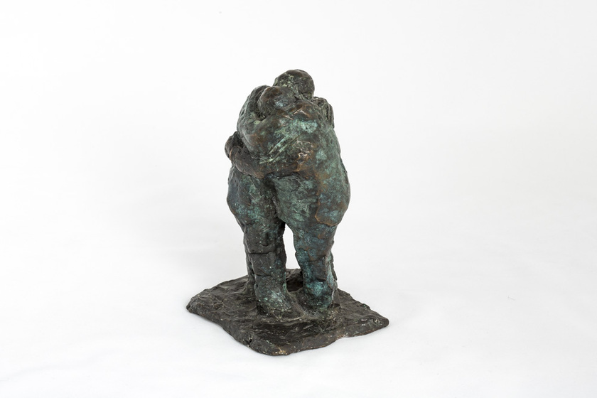 bronze sculpture of two hugging figures