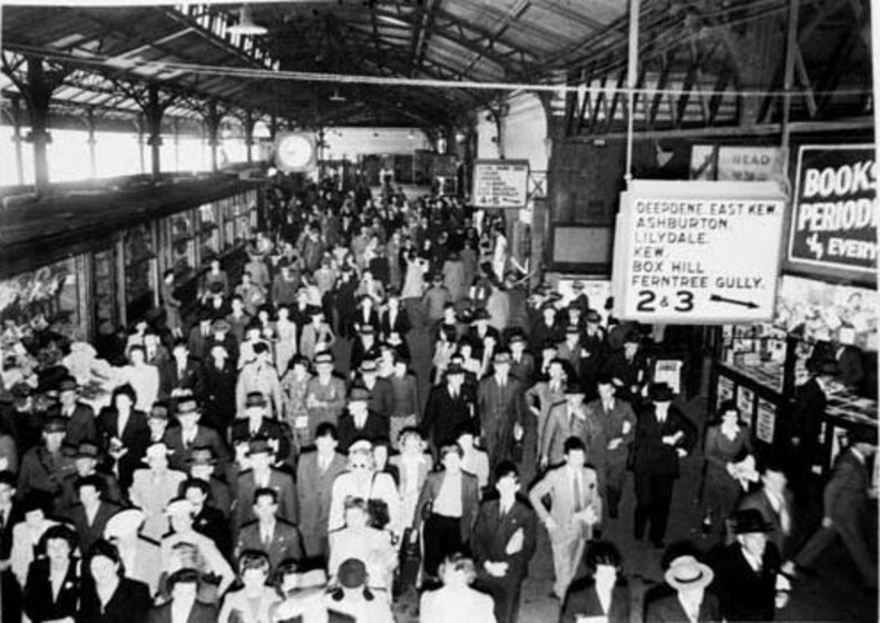 Crowds surge through the concourse
