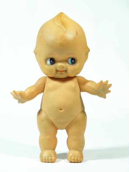 Doll without clothing, looking left