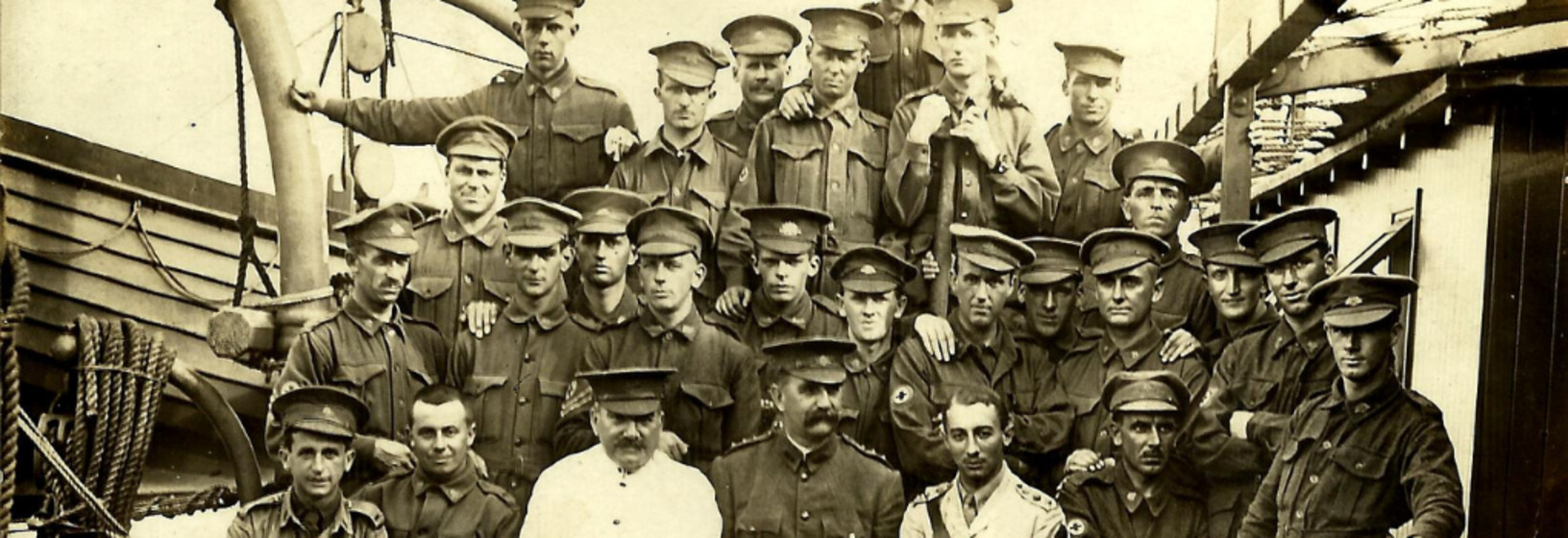 a group of men in assorted military uniform onboard a ship