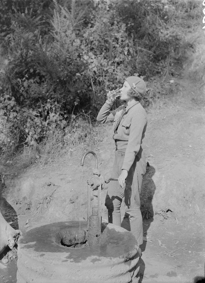 Woman drinking mineral water at Hepburn Springs some time in the mid 1940s or early 1950s. 