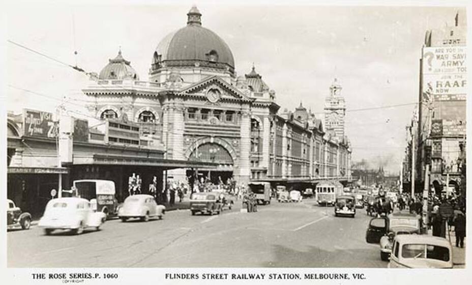 Flinders Street Railway Station with bustling traffic
