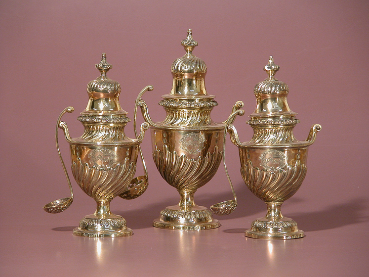 set of three ornate silverware sugar vases with spoons.