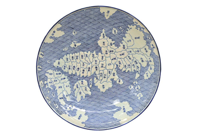 a blue and white ceramic platter featuring an early map of Japan.