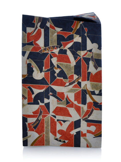 a vase decorated with an abstract, geometric pattern