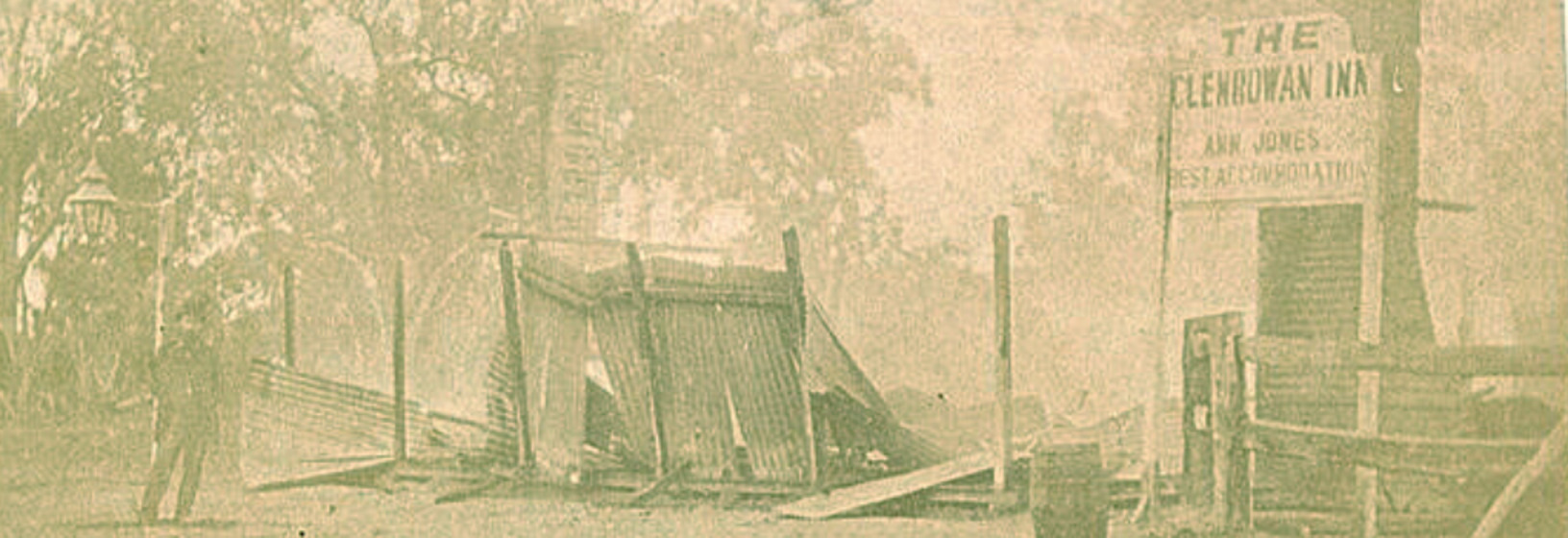 early image, burnt remains of a wooden building