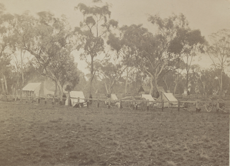 Location of Gravel Contractors’ Encampment with several tents and horse carts. Period image, sepia toned