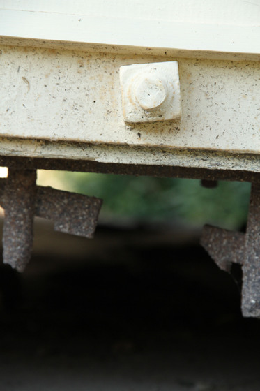Ends of the iron bars of the lock up that protrude at floor level.