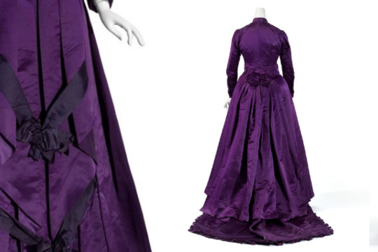 three views of a dark purple wedding dress on a mannequin