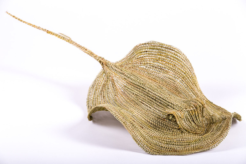 three-dimensional figure representing stingray swimming, made from woven natural flax
