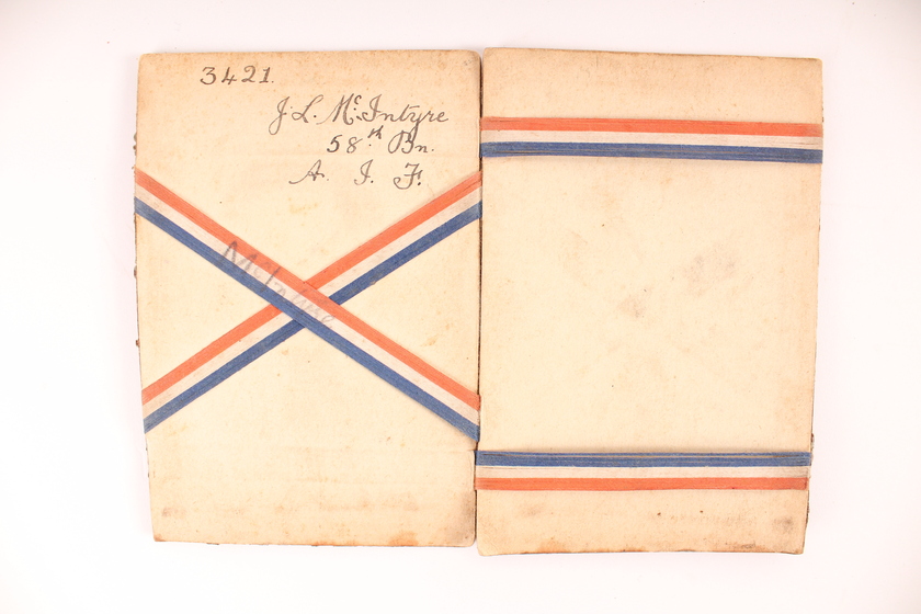 Booklet with red white blue elastic bands