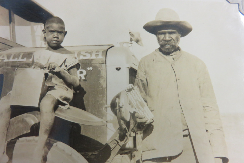 Indigenous man and boy on a truck