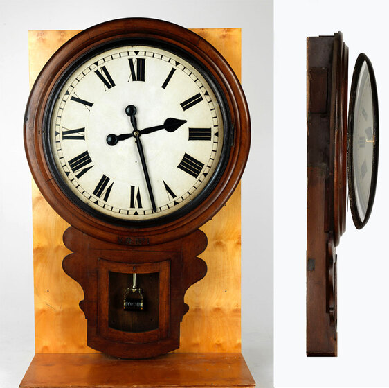 a large wooden wall clock