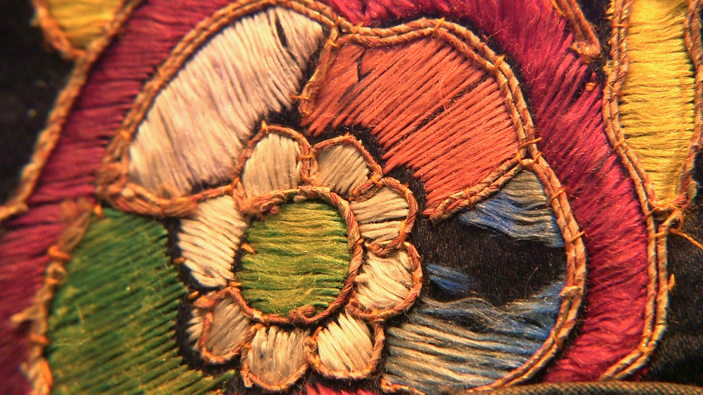Embroidered flower on parade costume jacket 