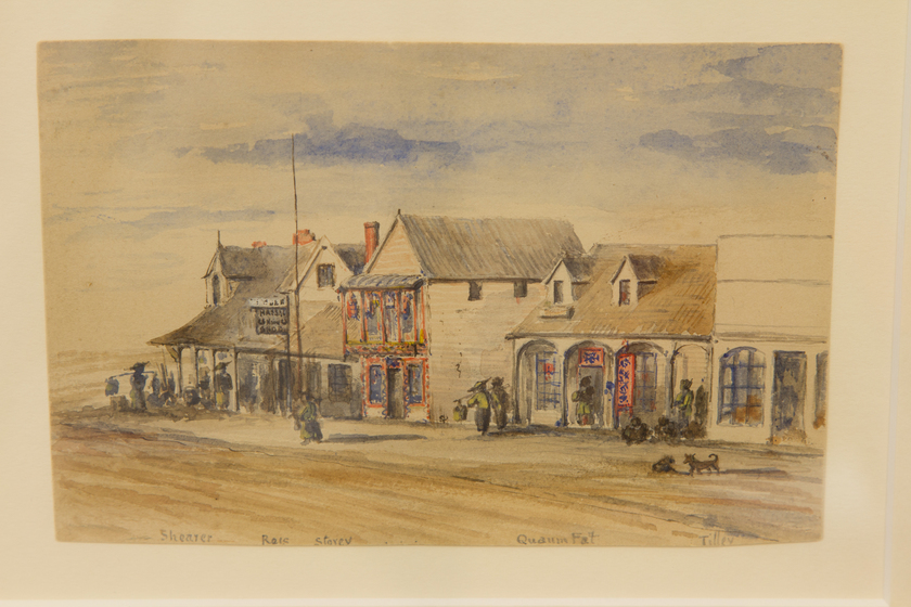 Watercolour painting of shop-lined street