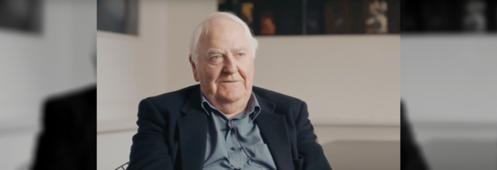 Man sitting addressing the camera