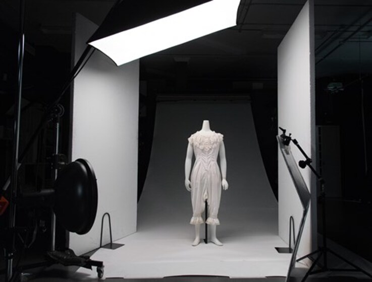 Photography studio with clothed mannequin in frame