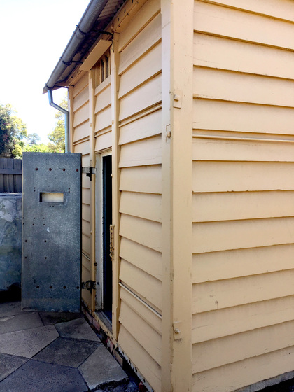 Exterior view of a wooden lock-up building
