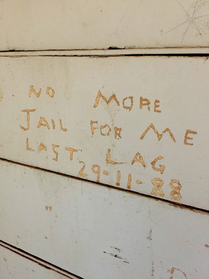 Interior graffiti on prison wall
