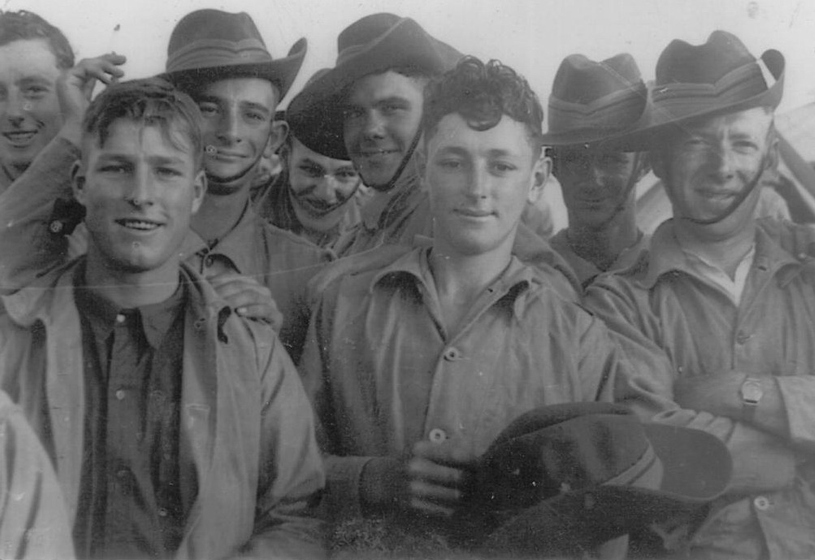 Eight young men in slouch hats