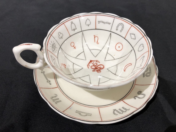 Tea cup with zodiac symbols