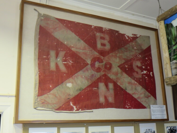 Framed flag red with white cross and letters