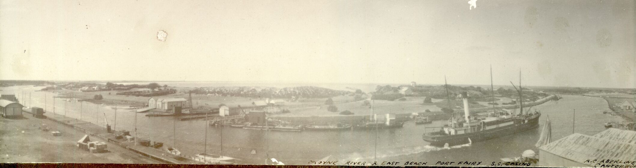 Panoramic photograph of steam ship in port