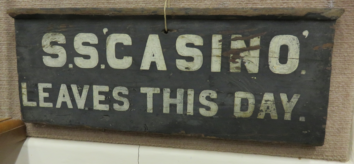 Wooden sign attached to fabric board