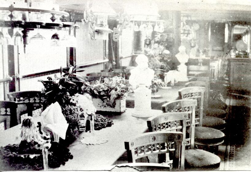Photograph of saloon chairs and chandeliers