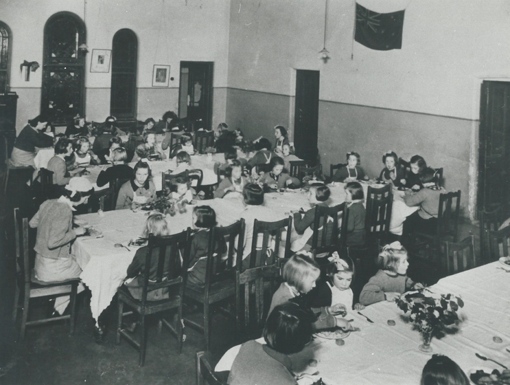 Children sitting at dinning tables